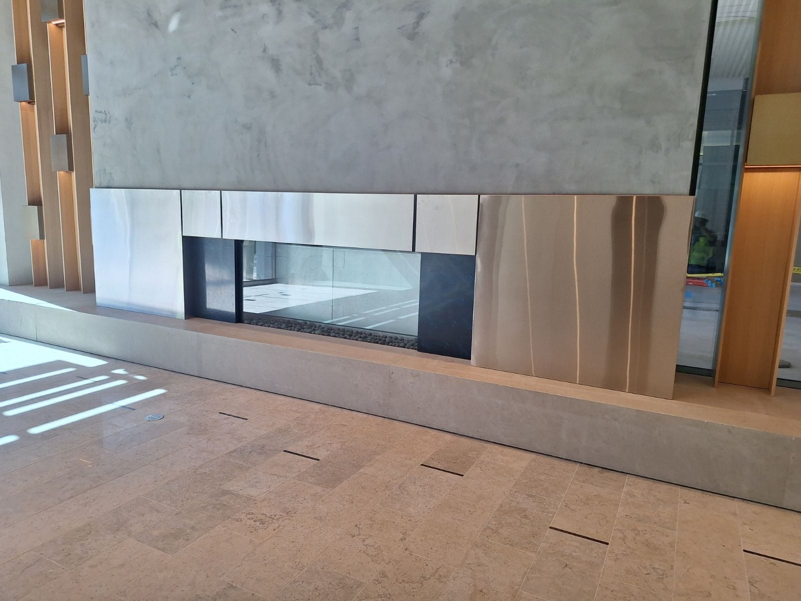 Modern atrium staircase with steel and wood