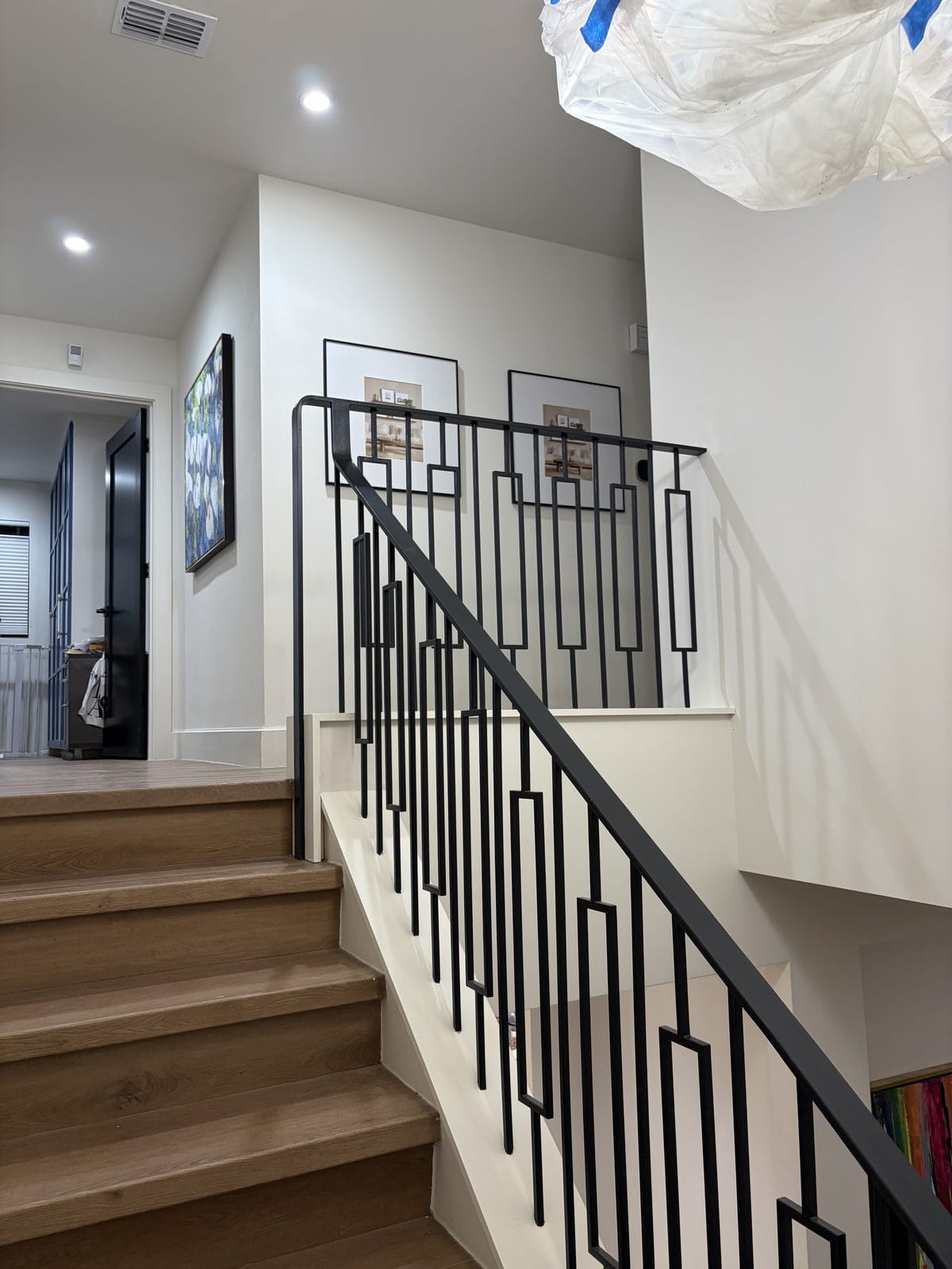 Interior staircase with custom metal railing